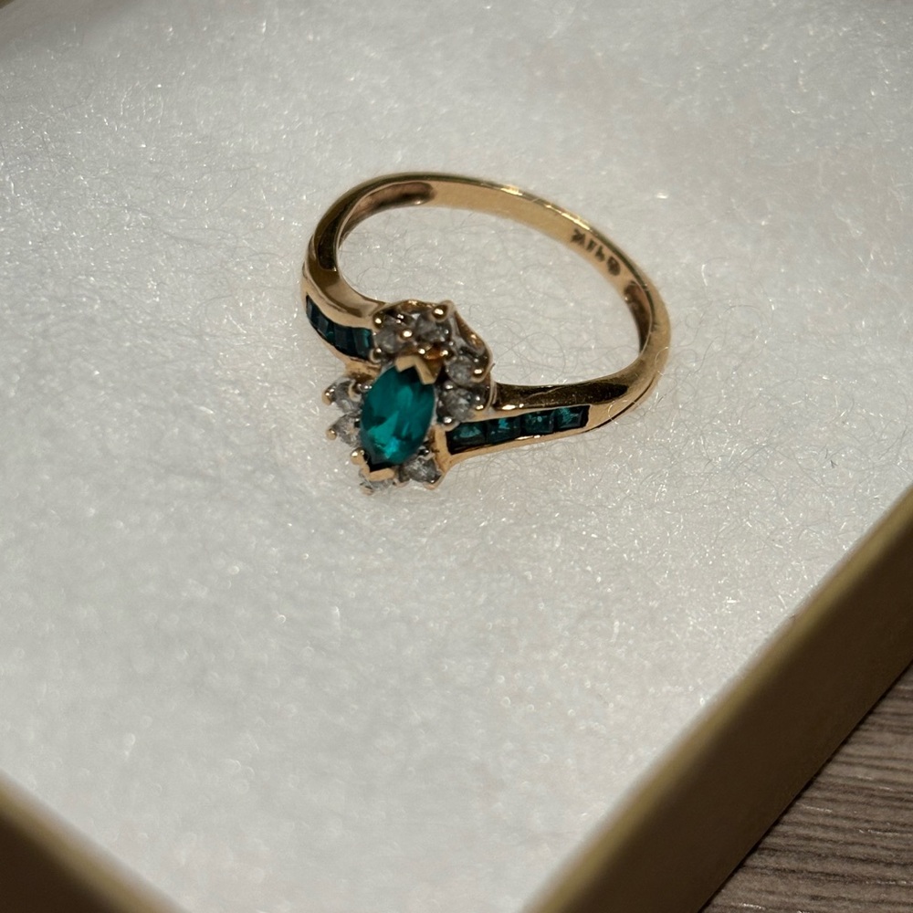 14k gold diamond ring with green marquise stone